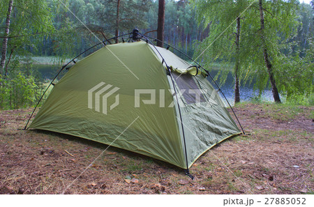 green tents are in the forest green tents are in the forest 27885052