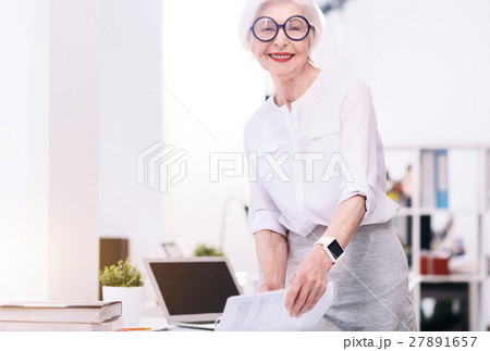 Positive aged businesswoman working in the office 27891657