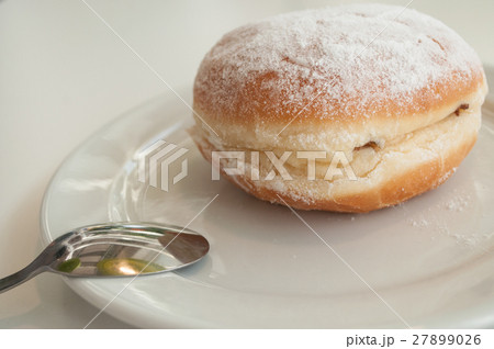 closeup of doughnut in a plate at restaurant 27899026
