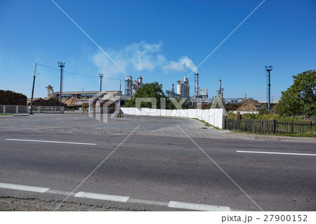 Wood factory with smoking chimneys 27900152