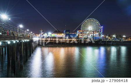 Venice beach at night with reflection in water. 27906418
