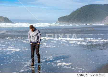 Lone man at USA Pacific coast beach 27907406