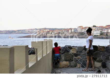 Son and mother walking on street of ?ncient city of Sozopol in Bulgaria 27911713