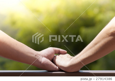 men gay couple holding hands on green nature men gay couple holding hands on green nature 27914386