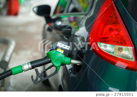 Car refueling on a petrol station in winter Car refueling on a petrol station in winter 27915051