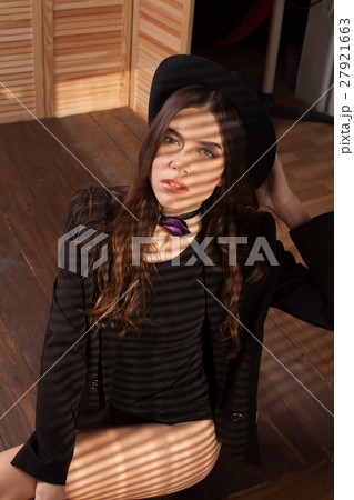 beautiful girl in Hat light from the window 27921663
