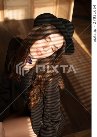 beautiful girl in Hat light from the window beautiful girl in Hat light from the window 27921664