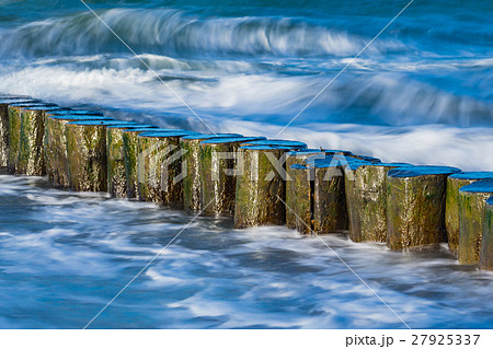 Groynes on shore of the Baltic Sea on a stormy day 27925337