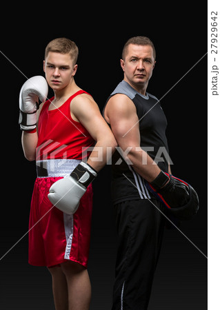 Young boxer working out with coach 27929642