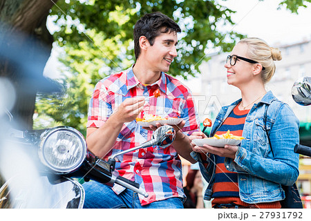Tourist couple taking rest during scooter tour  27931792