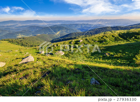 boulders in green grass on the hillside boulders in green grass on the hillside 27936330
