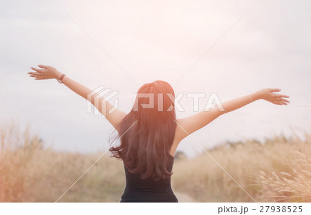 Portrait of happy and enjoying young woman 27938525