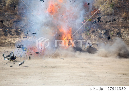 explosion of car part blown away from car bomb  27941380