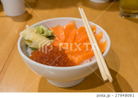 Fresh salmon slide with bowl rice on the table 27948061