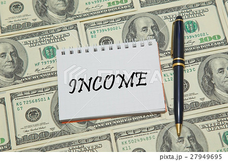 Notebook page with text INCOME on dollar backgroun Notebook page with text INCOME on dollar backgroun 27949695
