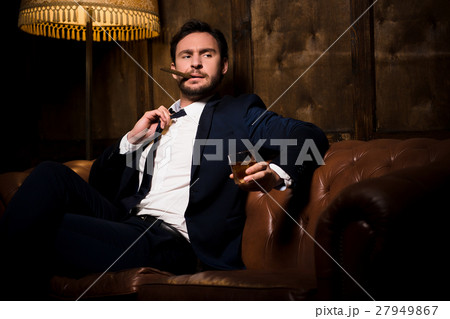 Rich businessman with cigar Rich businessman with cigar 27949867