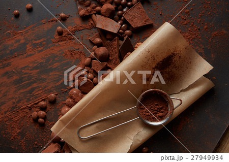 Cocoa powder on parchment Cocoa powder on parchment 27949934
