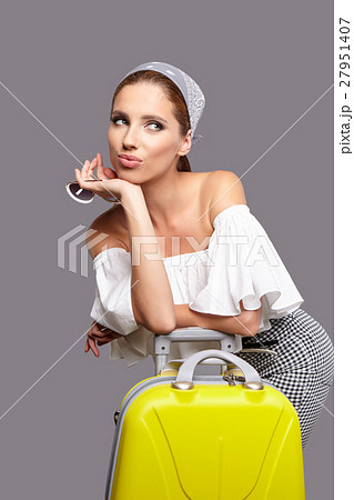 Glamour woman with yellow suitcase, travel concept 27951407
