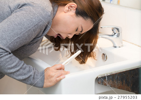 Asian woman severe morning sickness in bathroom Asian woman severe morning sickness in bathroom 27955203