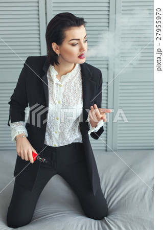 Business woman smokes. Business woman smokes. 27955970