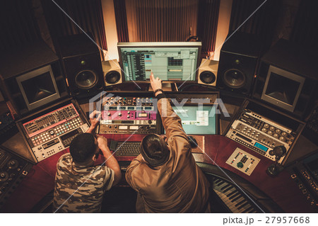 Sound engineer and musician recording song in Sound engineer and musician recording song in 27957668
