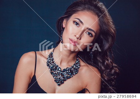 Brunette girl with a beautiful necklace and Brunette girl with a beautiful necklace and 27958694