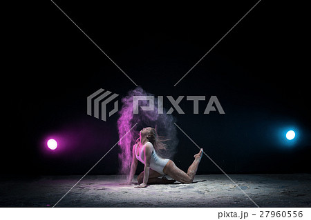 Slender girl posing in color dust cloud in studio Slender girl posing in color dust cloud in studio 27960556
