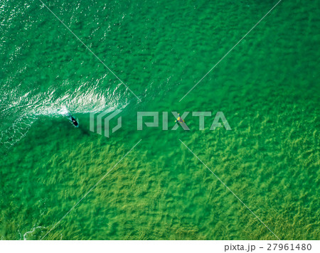 Surfers Waiting Waves on the Surface of the Ocean Surfers Waiting Waves on the Surface of the Ocean 27961480