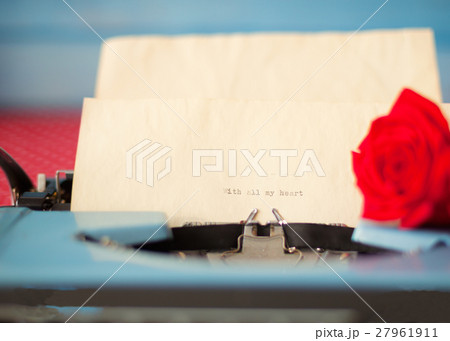Vintage typewriter with love message and rose 27961911
