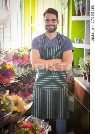 Male florist with arms crossed at his flower shop 27963536