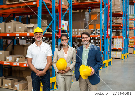 Portrait of managers are holding hard hat and posing 27964081