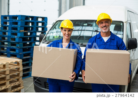 Smiling workers looking at camera 27964142