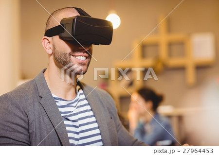 Male graphic designer wearing virtual glasses Male graphic designer wearing virtual glasses 27964453