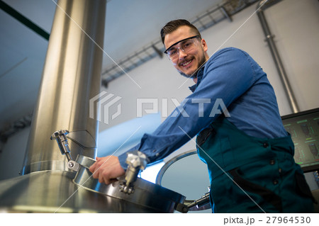 Maintenance worker working at brewery Maintenance worker working at brewery 27964530