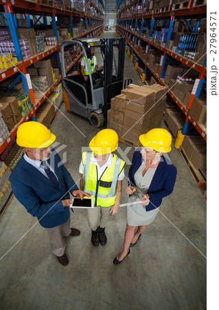 High angle view of managers talking with a worker 27964571