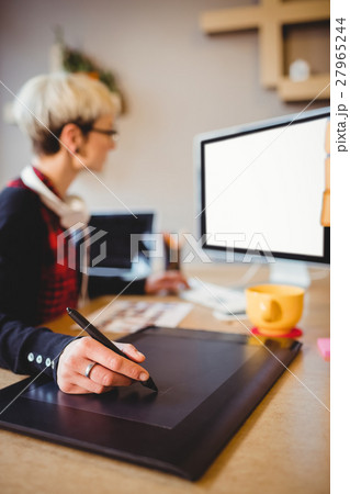 Graphic designer using graphics tablet Graphic designer using graphics tablet 27965244