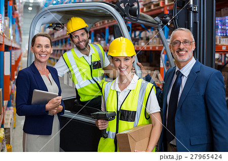 Businessman controlling digital device of worker Businessman controlling digital device of worker 27965424
