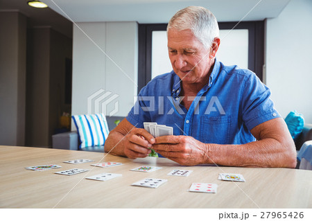 Senior man playing cards 27965426