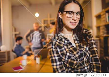 Graphic designer in spectacles at office Graphic designer in spectacles at office 27965541