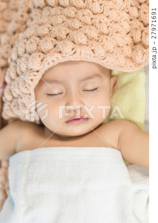 Baby sleeping on bed in the bedroom Baby sleeping on bed in the bedroom 27971691