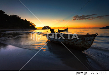 Small boat at the Andaman Sea  at sunset 27973368