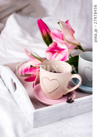 tray with cup of hot tea in the bed, tray with cup of hot tea in the bed, 27978456