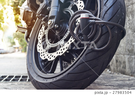 padlock security lock blocking motorcycle wheel 27983504