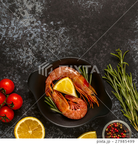 Grilled shrimps with lemon and rosemary. Grilled shrimps with lemon and rosemary. 27985499