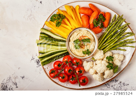 Healthy homemade hummus with assorted vegetables. Healthy homemade hummus with assorted vegetables. 27985524