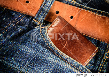 Brown leather wallet on jeans background 27985685