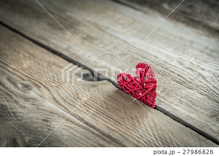 Handmade retro heart on the wooden background Handmade retro heart on the wooden background 27986826