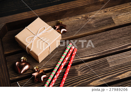 Brown wooden tray with Christmas decorations Brown wooden tray with Christmas decorations 27989206