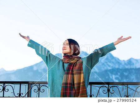 Portrait of a young redhead woman with mountains on background Portrait of a young redhead woman with mountains on background 27990524