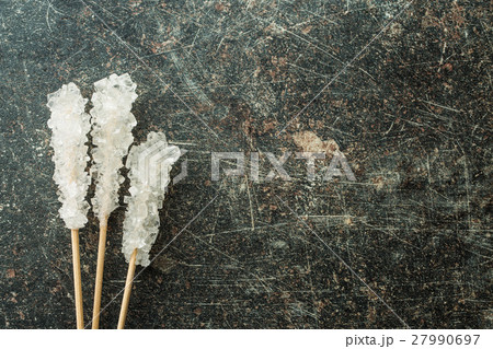 Crystallized sugar on wooden stick. 27990697